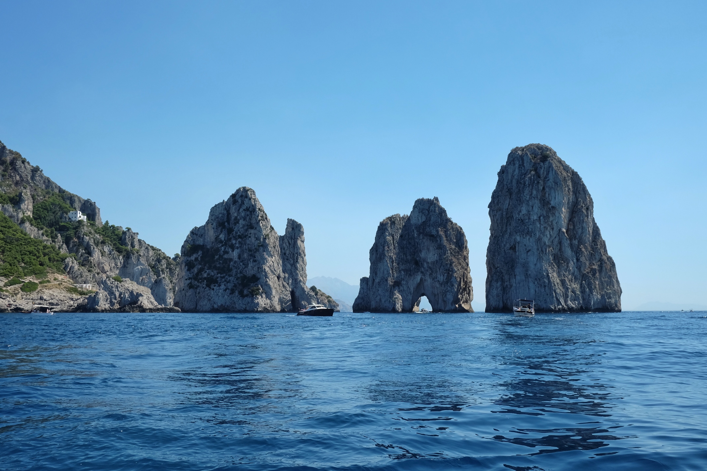 The Faraglioni are the famous three rocks off of Capri.