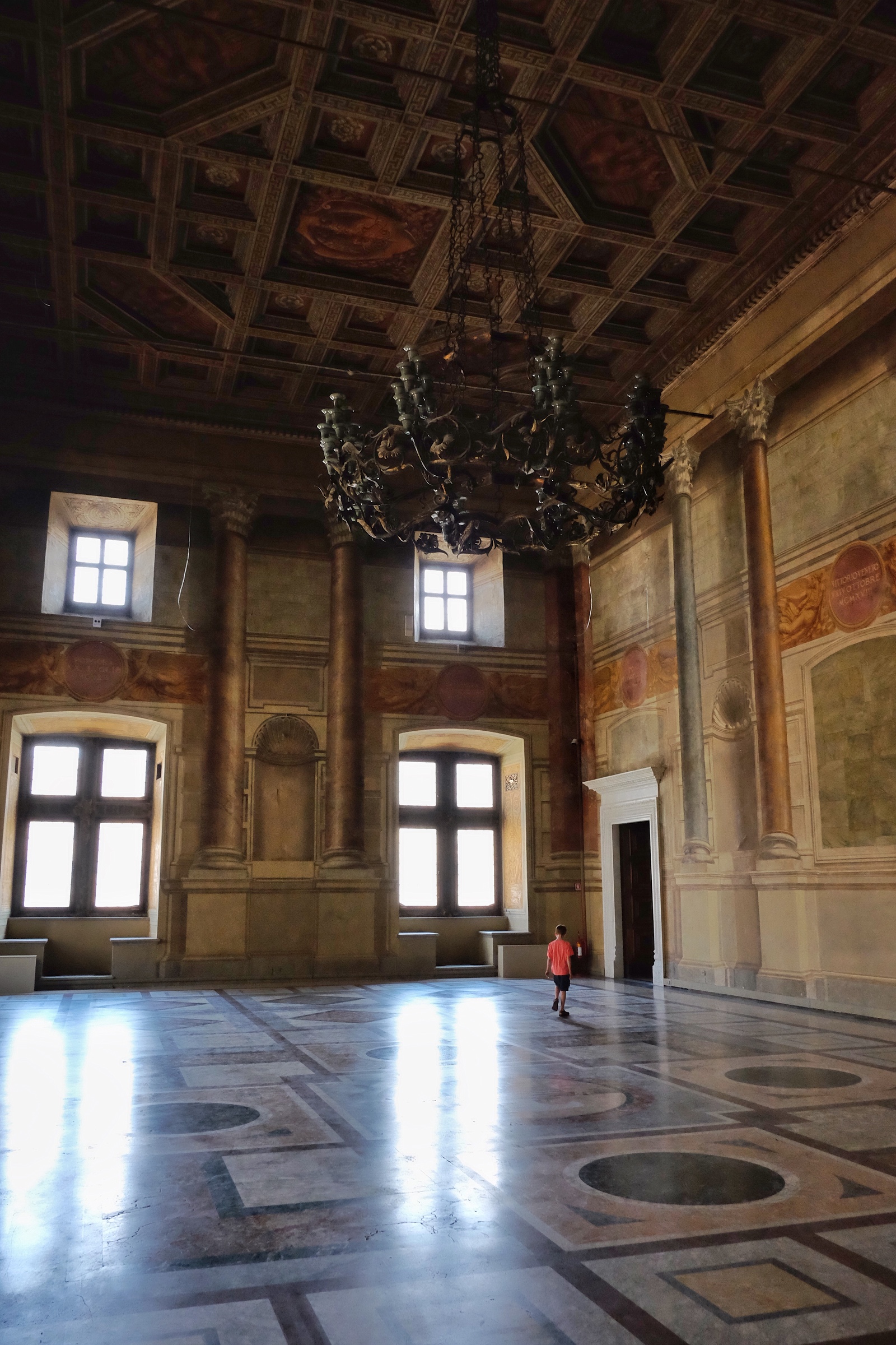 Rowan strolling through one of the gorgeous rooms in Palazzo Venezia.